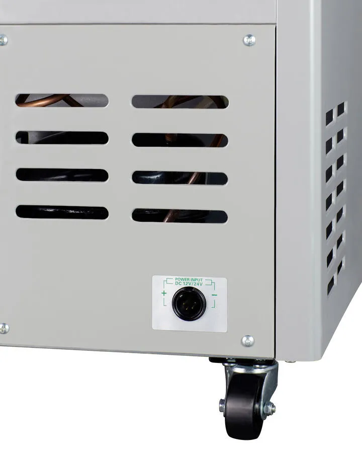 Summit SPRF86M2 Portable 12V/24V Cooler Capable Of Operation As Refrigerator (2-8(Degree)C) Or Freezer (-12(Degree)C). With Insulated Cover. Interior Wire Basket. Factory-Installed Lock. Strap Handle. And Four Pre-Installed Wheels